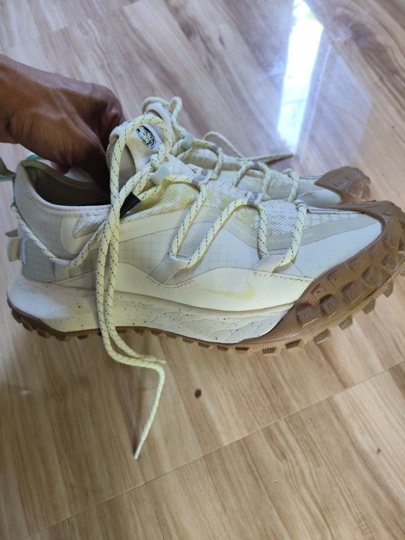 Nike ACG Mountain Fly Low Gore-Tex Cream (Category: Sneakers) located in Dinagat. Submitted by mysticcat.20b41a (Listing ID 1468745507, Image 2). Description: - Brand/Model: Nike ACG Mountain Fly Low Gore-Tex - Colorway: Cream and yellow - Key Tech: Nike React foam midsole, Carbon fiber Flyplate, and waterproof Gore-Tex membrane - Features: Rugged traction lugs, quick-lace system with reflective details - Condition: Visible scuffs and fabric wear