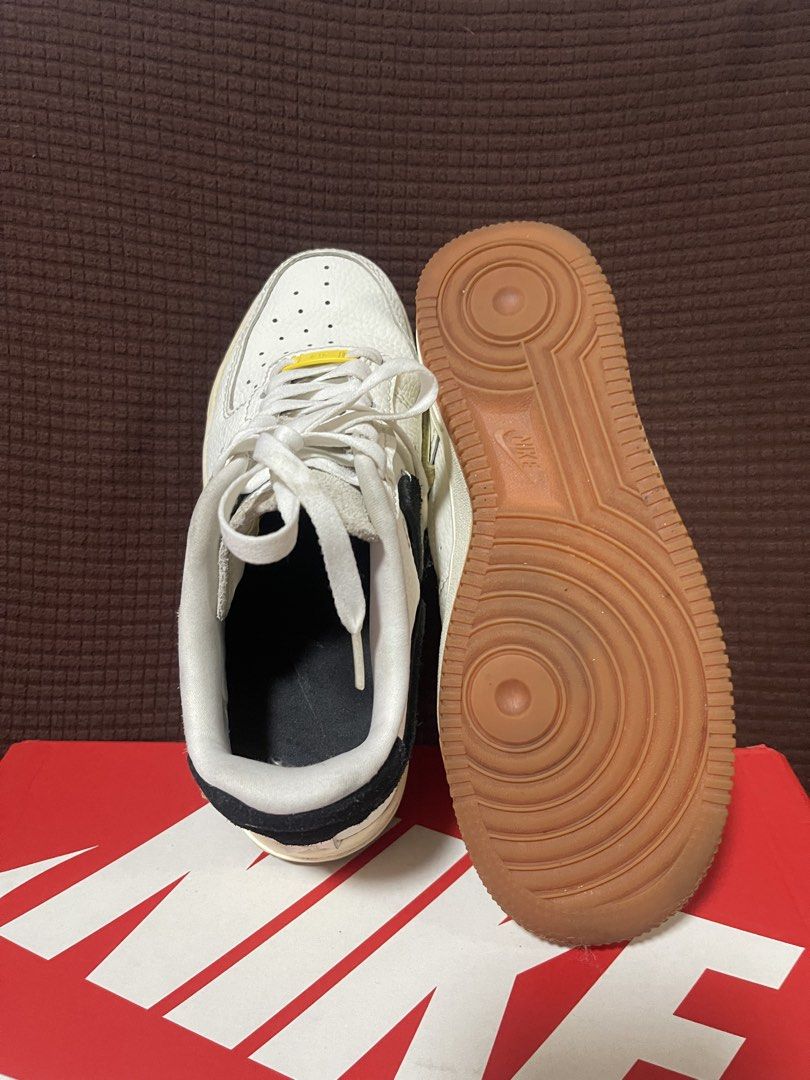 Nike Air Force 1 Low Retro White Gum (Category: Sneakers) located in Davao. Submitted by rcgulanes.moon (Listing ID 1468838689, Image 3). Description: - Model: Nike sneakers with a deconstructed vibe - Upper: White tumbled leather with split-color black and olive suede swooshes - Details: Yellow lace dubrae and gum rubber outsole - Condition: Clean soles with minimal wear - Inclusions: Original red Nike shoebox included.