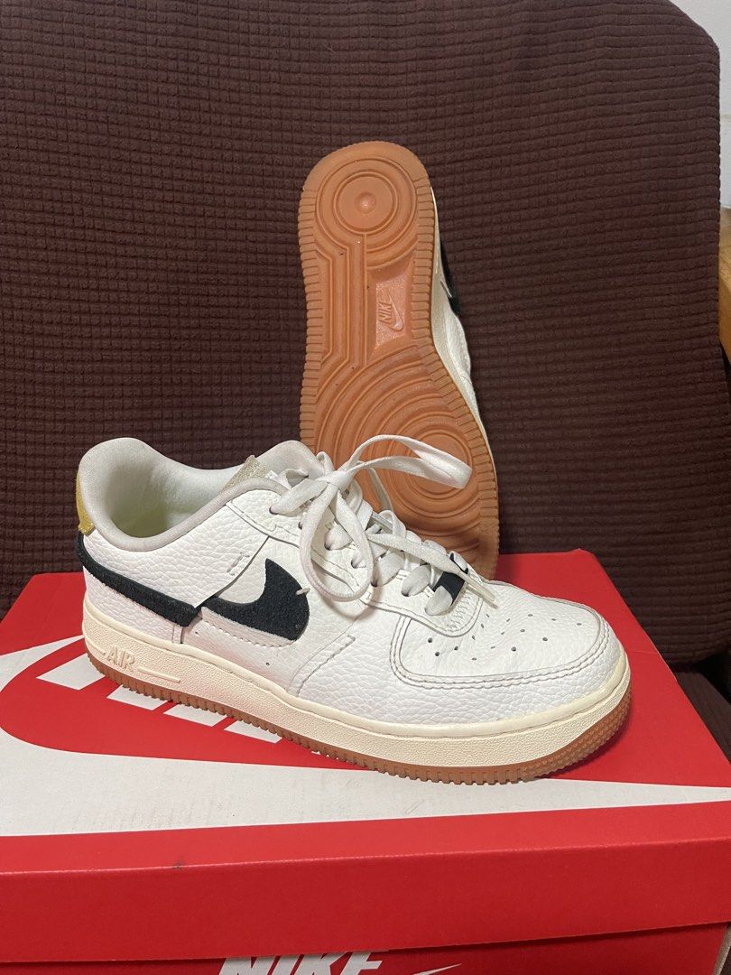 Nike Air Force 1 Low Retro White Gum (Category: Sneakers) located in Davao. Submitted by rcgulanes.moon (Listing ID 1468838689, Image 2). Description: - Model: Nike sneakers with a deconstructed vibe - Upper: White tumbled leather with split-color black and olive suede swooshes - Details: Yellow lace dubrae and gum rubber outsole - Condition: Clean soles with minimal wear - Inclusions: Original red Nike shoebox included.
