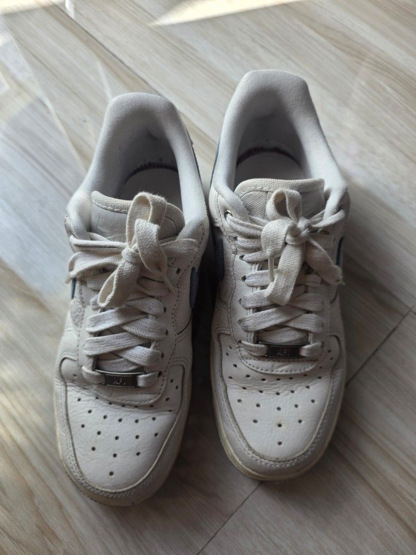 Nike Air Force 1 White Blue Size US 5.5 (Category: Sneakers) located in Santa Rosa. Submitted by verafaye (Listing ID 1468787042, Image 2). Description: - Brand/Model: Nike Air Force 1 Low (Style Code: DX1193-100) - Colorway: Classic white leather upper with bold blue swoosh accents - Size: US 5.5, UK 3, EUR 36 - Perfect everyday streetwear sneakers! Bought it in Nike the Fort for 6,000PHP. No box and sellingit very low now 😊.