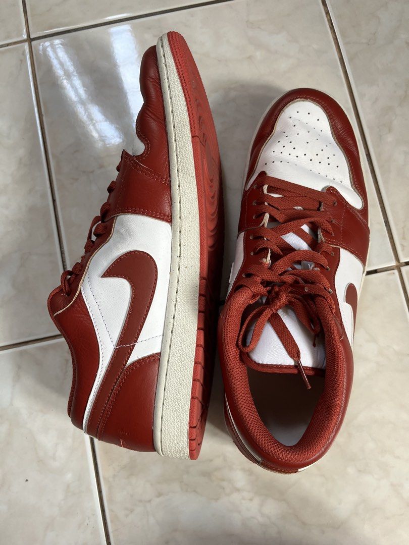 Nike Air Jordan 1 Low Red White (Category: Sneakers) located in Makati City. Submitted by ojala (Listing ID 1468743862, Image 1). Description: - Red and white leather low-top sneakers - Classic court style with signature wing logo embroidered on the heel - Minor creases on the toe box from previous wear - Soles show light dirt, but tread remains solid - Laces match the striking red overlays.