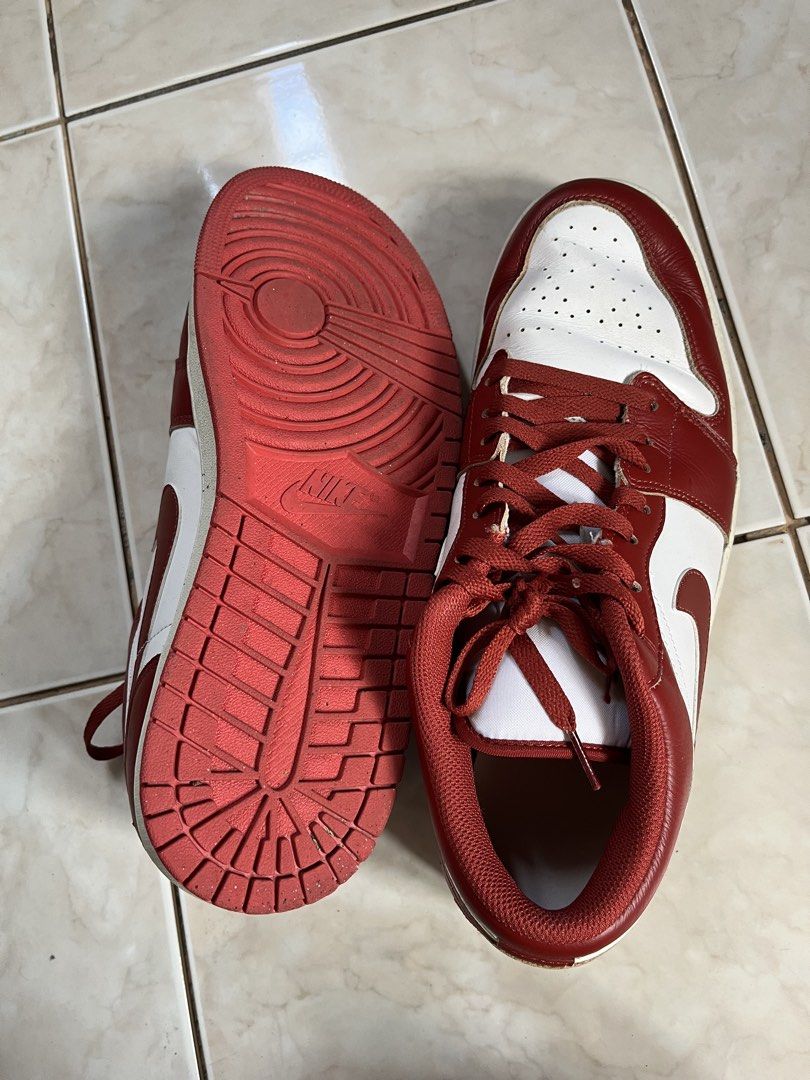 Nike Air Jordan 1 Low Red White (Category: Sneakers) located in Makati City. Submitted by ojala (Listing ID 1468743862, Image 2). Description: - Red and white leather low-top sneakers - Classic court style with signature wing logo embroidered on the heel - Minor creases on the toe box from previous wear - Soles show light dirt, but tread remains solid - Laces match the striking red overlays.