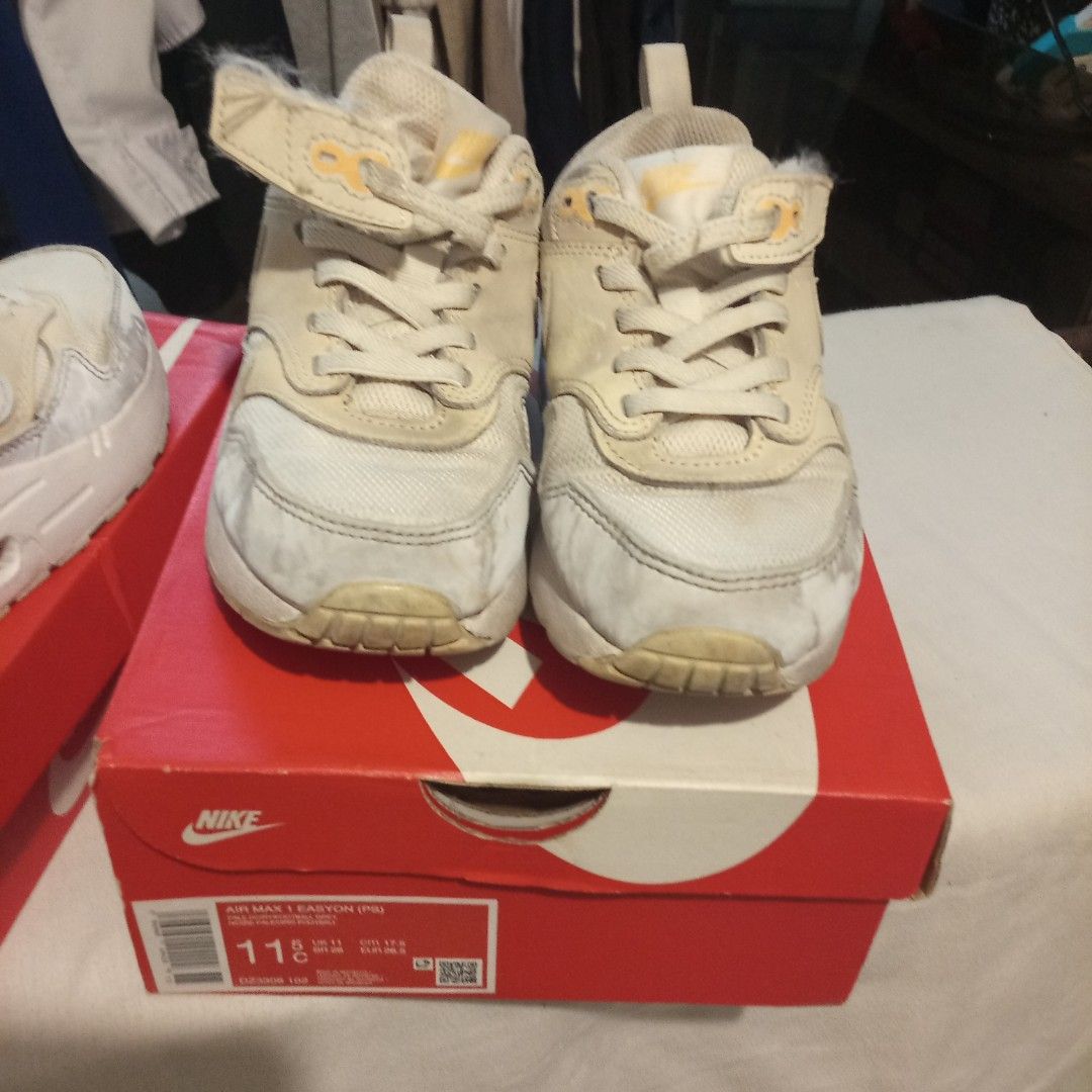 Nike Air Max 1 Easyon PS Pale Ivory (Category: Sneakers) located in Pasig City. Submitted by zakquinnjax44 (Listing ID 1468738380, Image 3). Description: - Brand/Model: Nike Air Max 1 Easyon Preschool Sneakers - Size: 11.5C / EUR 28.5 - Colorway: Pale Ivory / Football Grey - Features: Convenient easy-on strap design - Packaging: Original box included - Condition: Shows scuffs and wear on uppers and soles.