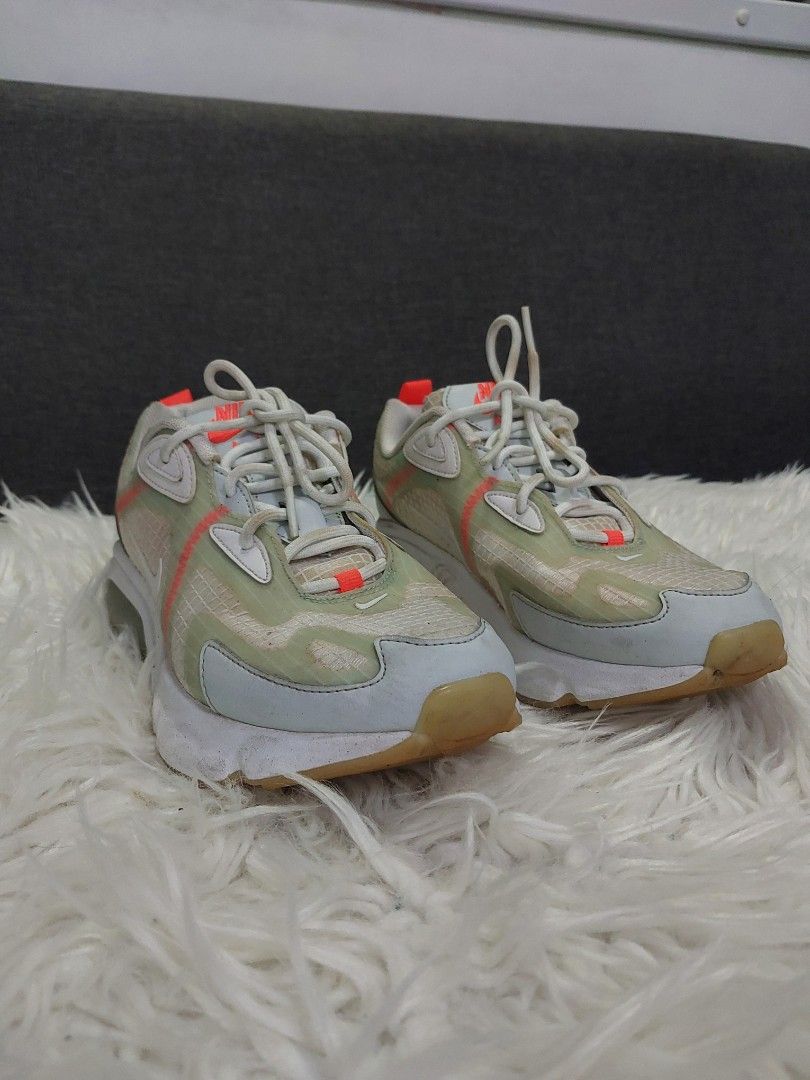 Nike Air Max 200 White Orange Size US 7 (Category: Sneakers) located in Cavite. Submitted by tobias_7795 (Listing ID 1468764186, Image 2). Description: - Brand/Model: Nike Air Max 200 trainers - Colorway: White and green transparent upper with bright orange contrast stitching and pull tabs - Sole: Gum rubber outsole with visible Air unit in the heel - Size: US 7 / UK 4.5 / EUR 38 - Condition: Normal signs of wear on soles and uppers.