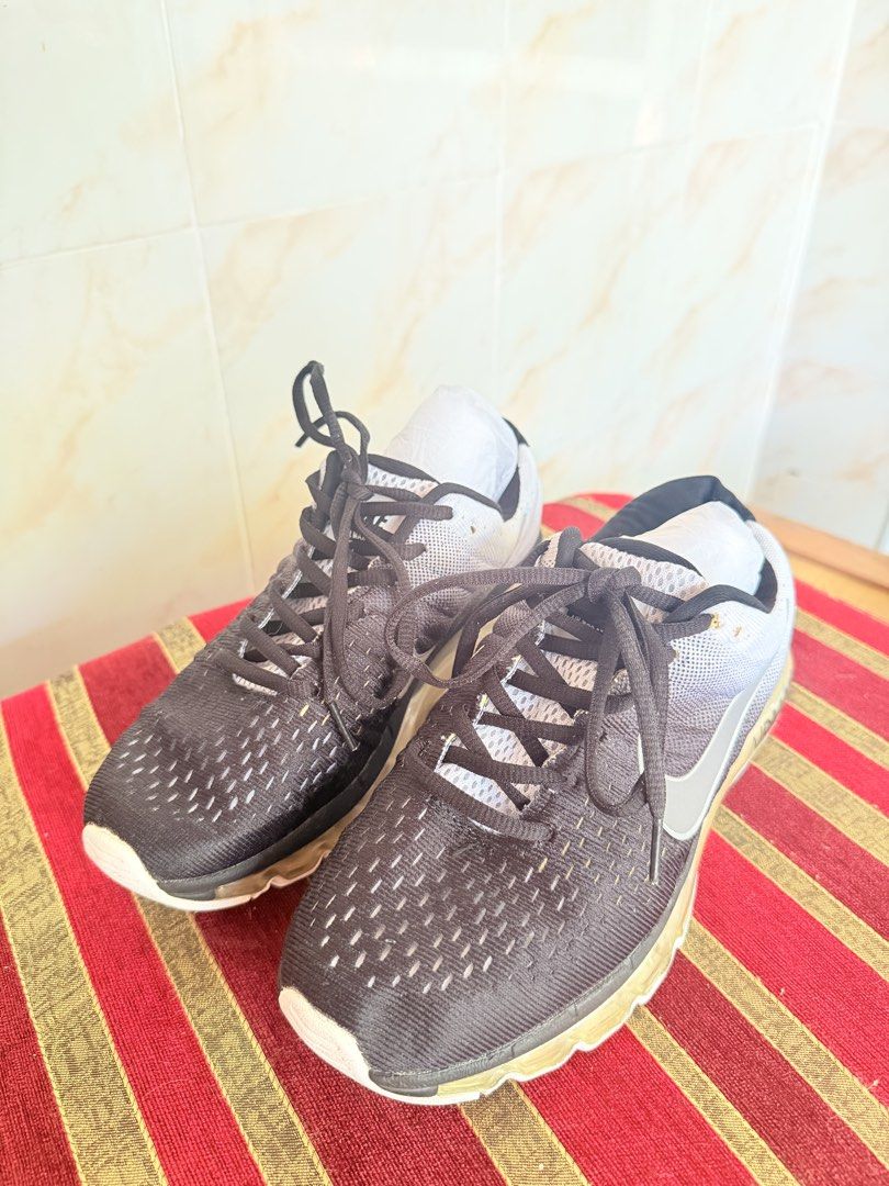 Nike Air Max Black Grey Running Shoes (Category: Sneakers) located in Manila. Submitted by sedpuprincess (Listing ID 1468785927, Image 2). Description: - Authentic Nike Air Max running shoes - Stylish black and grey gradient mesh upper with silver swoosh - Full-length air cushioning sole for maximum comfort - Classic black laces - Stored with paper stuffing in the toe box to maintain original shape - Limited stock, grab them before they're gone!.
