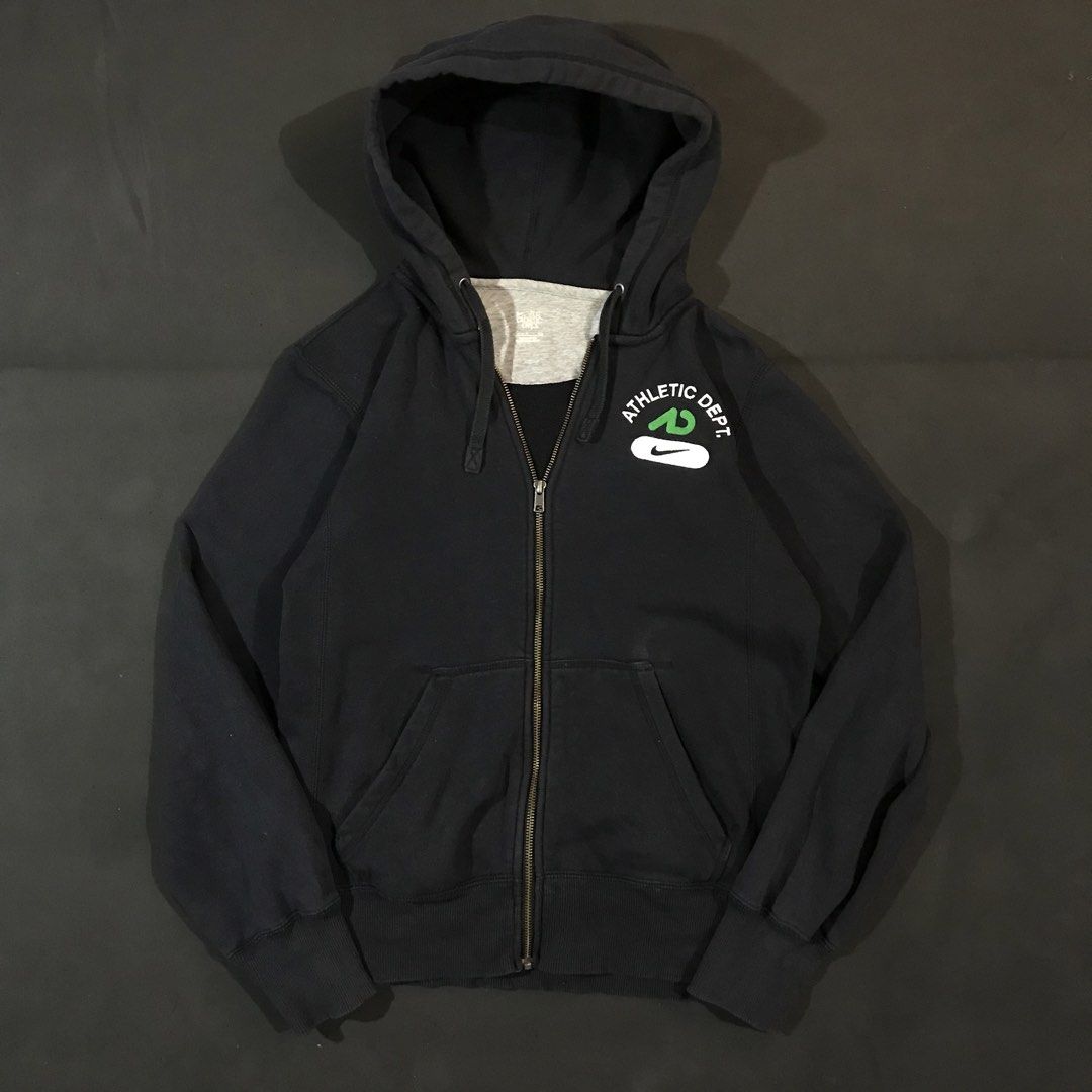 Nike Athletic Dept. Full-Zip Hoodie (Category: Coats, Jackets and Outerwear) located in Manila. Submitted by a_aron.f6e3a7 (Listing ID 1468783352, Image 1). Description: Size: L slim fit • Color rate: 9/10 (Black with White, Green, and Gray Logo Details) • Condition: Good pre-owned condition • Issues: Visible wrinkles and creases; no obvious major holes, tears, or heavy stains.