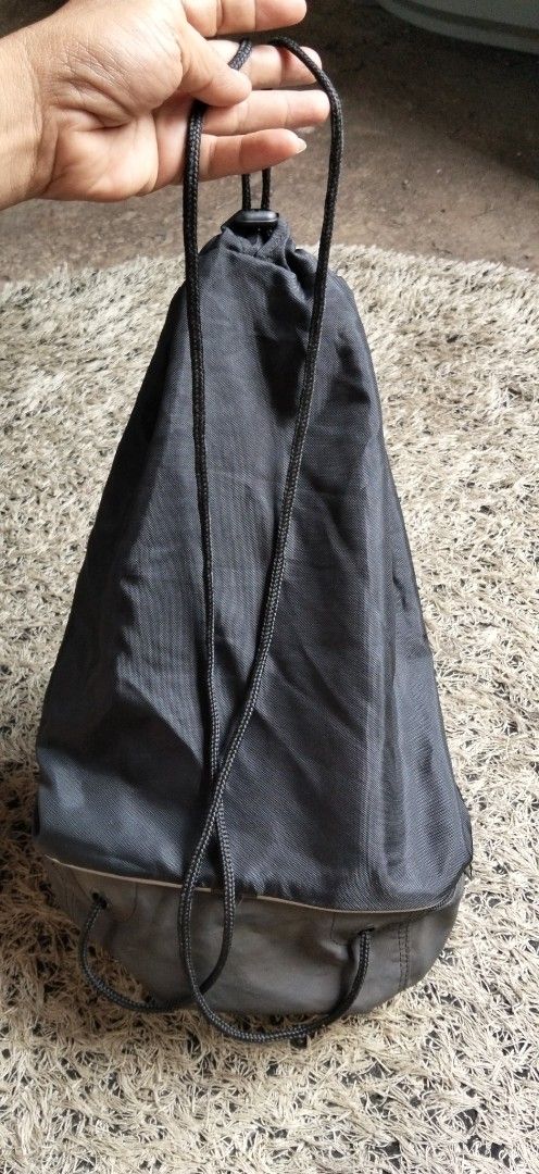 Nike Black Drawstring Gym Bag with Bottom Compartment (Category: Backpacks) located in Paranaque City. Submitted by michael-08 (Listing ID 1468750255, Image 2). Description: - Authentic black Nike drawstring backpack in excellent, clean condition - Features a large, stylish light-coloured Swoosh logo on the front - Handy separate zipped bottom compartment ideal for shoes or wet/dirty gear - Made from durable, lightweight nylon material with sturd