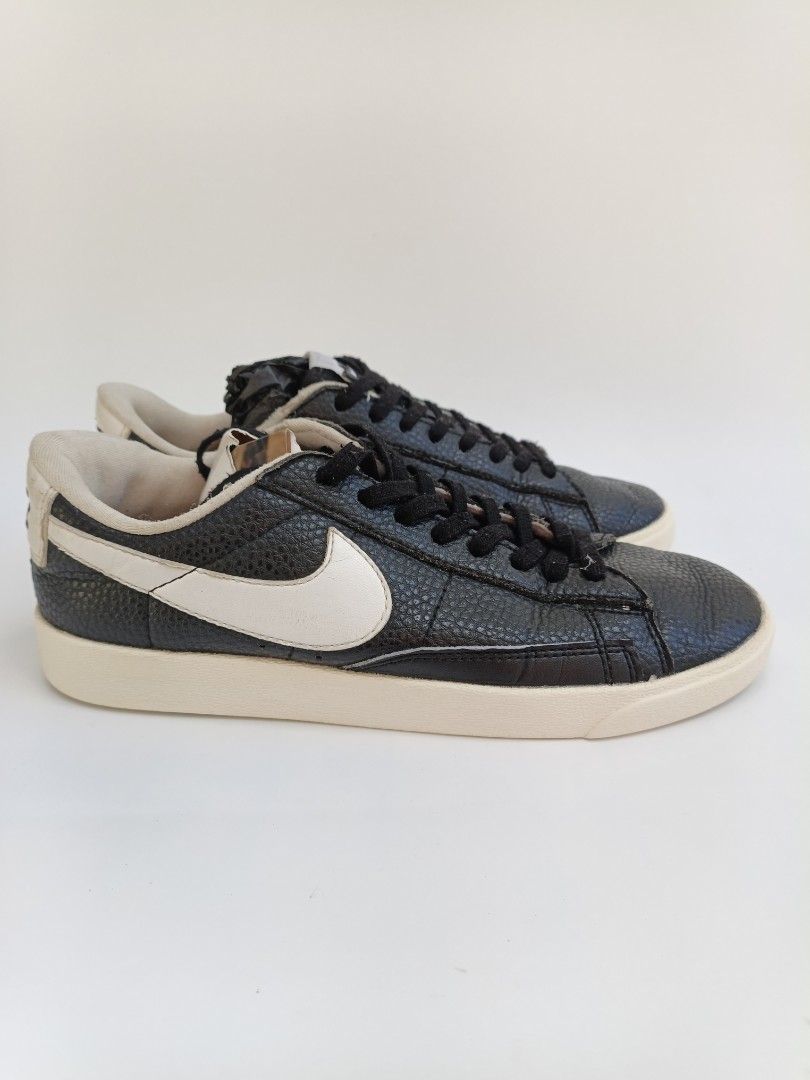 Nike Blazer Low Black White Leather Sneakers (Category: Sneakers) located in Imus. Submitted by grindhouse.thriftshop (Listing ID 1468760636, Image 3). Description: - Brand/Model: Nike Blazer Low - Colorway: Black and white with contrast white swoosh - Material: Pebbled leather upper - Design: Classic low-top with standard Nike tongue branding and black laces - Condition: Well-worn with minor creasing and some wear on the soles - Perfect for ever