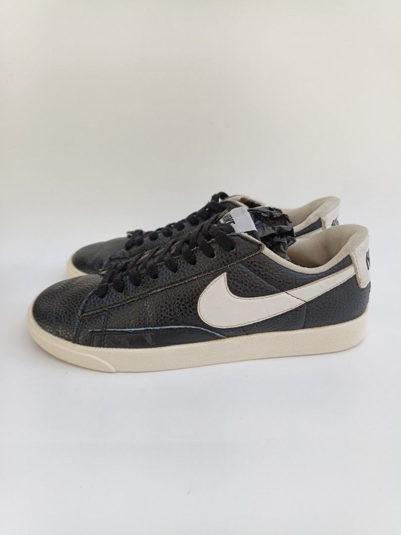 Nike Blazer Low Black White Leather Sneakers (Category: Sneakers) located in Imus. Submitted by grindhouse.thriftshop (Listing ID 1468760636, Image 2). Description: - Brand/Model: Nike Blazer Low - Colorway: Black and white with contrast white swoosh - Material: Pebbled leather upper - Design: Classic low-top with standard Nike tongue branding and black laces - Condition: Well-worn with minor creasing and some wear on the soles - Perfect for ever