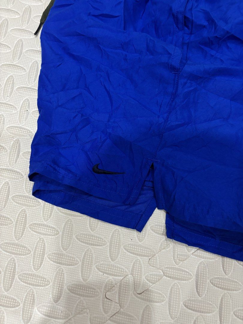 Nike Blue Shorts Size S (Category: Shorts) located in Manila. Submitted by noribrahim.20 (Listing ID 1468873349, Image 3). Description: - Brand: Nike - Condition: Brand new with tags (BNWT) - Color: Bright blue - Size: Men's Small - Material: 100% polyester (inside and out) - Features: Elastic waistband with drawstring, embroidered black Nike swoosh on lower left leg - Origin: Made in Indonesia.