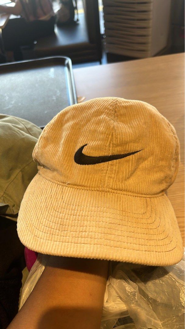Nike Corduroy Baseball Cap Beige (Category: Caps & Hats) located in Zarraga. Submitted by plandee92 (Listing ID 1468847508, Image 1). Description: - Brand: Nike - Material: Beige corduroy with clean interior lining - Design: Classic curved brim, structured panels, and embroidered swoosh on the front - Details: Additional branding on the back and side - Fit: Adjustable metal strapback closure for a customizable fit - Condition: Great vintage aesth