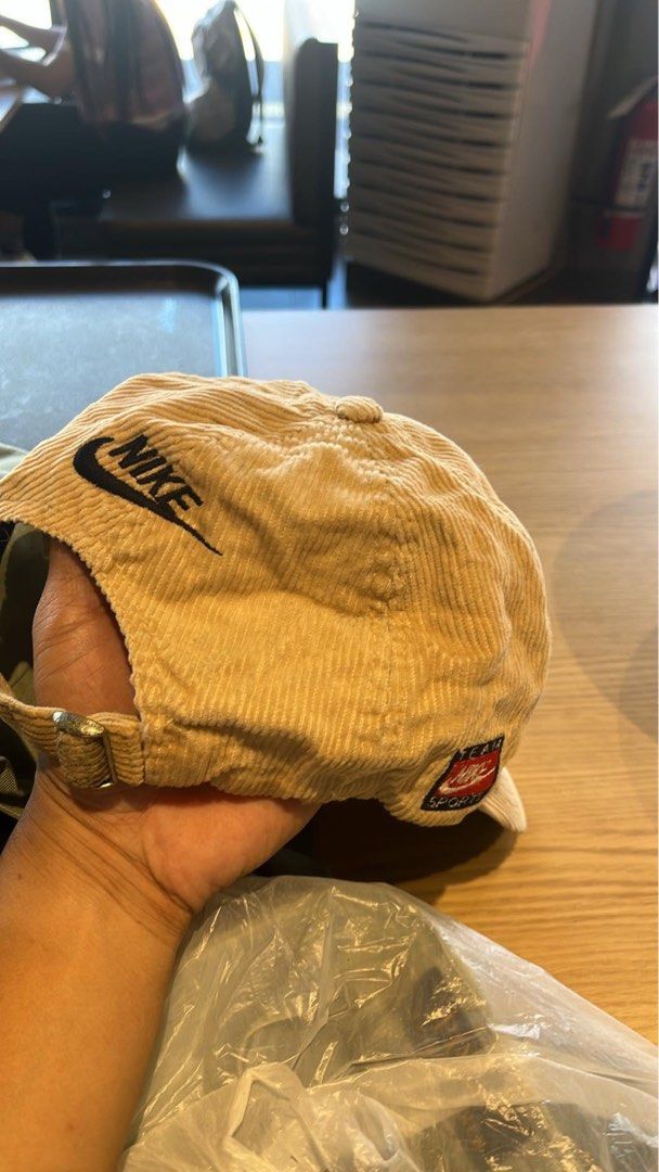 Nike Corduroy Baseball Cap Beige (Category: Caps & Hats) located in Zarraga. Submitted by plandee92 (Listing ID 1468847508, Image 3). Description: - Brand: Nike - Material: Beige corduroy with clean interior lining - Design: Classic curved brim, structured panels, and embroidered swoosh on the front - Details: Additional branding on the back and side - Fit: Adjustable metal strapback closure for a customizable fit - Condition: Great vintage aesth