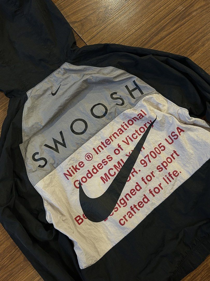 Nike Double Swoosh Windbreaker (Category: Coats, Jackets and Outerwear) located in Manila. Submitted by 144thrift_shits (Listing ID 1468727278, Image 2). Description: Nike Double Swoosh Windbreaker Size on tag:none Dimes: 22x27 Color rate: 9.5/10 Condition: 9.5/10 Issue: minimal crack prints (unnoticeable) 🏷️: 1600 + sf.