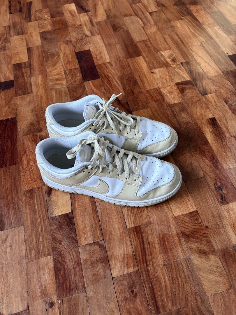 Nike Dunk Low 'Team Gold' (US 10.5) (Category: Sneakers) located in Quezon City. Submitted by juanchoconsunji (Listing ID 1468794584, Image 3). Description: Designed around a timeless two-tone look, the Nike Dunk Low ‘Team Gold’ features a clean white crisp leather upper accented by warm Team Gold leather overlays, matching swoosh logos, laces, and outsoles. Equipped with standard breathable mesh tongues and lining, this colorway offers a versati