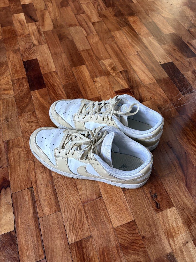 Nike Dunk Low 'Team Gold' (US 10.5) (Category: Sneakers) located in Quezon City. Submitted by juanchoconsunji (Listing ID 1468794584, Image 1). Description: Designed around a timeless two-tone look, the Nike Dunk Low ‘Team Gold’ features a clean white crisp leather upper accented by warm Team Gold leather overlays, matching swoosh logos, laces, and outsoles. Equipped with standard breathable mesh tongues and lining, this colorway offers a versati