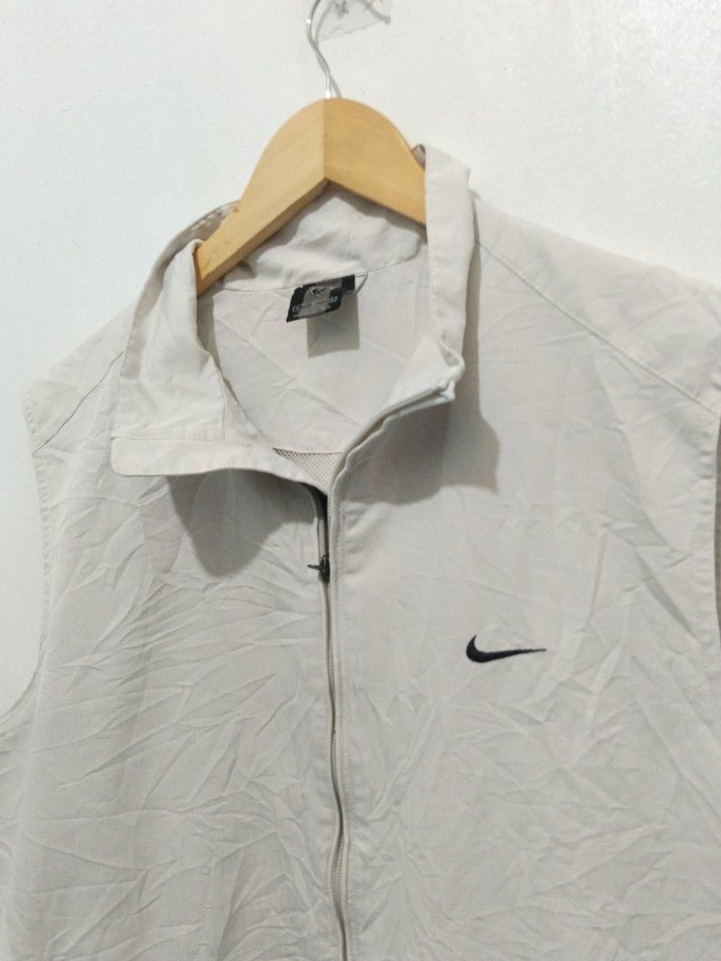 Nike Golf Zip Vest Size XL (Category: Vests) located in Abucay. Submitted by ukay_withdj (Listing ID 1468731915, Image 2). Description: - Brand: Nike Golf - Color: Light Beige - Size: XL - Condition: Excellent - Details: Full zip front, high collar, sleeveless - Pockets: Two secure zip side pockets - Branding: Small embroidered Swoosh on chest, Nike Golf logo on back neck - Origin: Made in China.