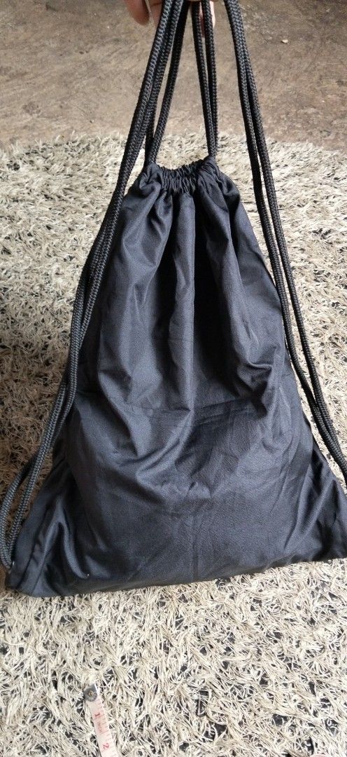 Nike Gymsack Drawstring Backpack Black Gold BA4656 (Category: Backpacks) located in Paranaque City. Submitted by michael-08 (Listing ID 1468752298, Image 3). Description: - Brand: Nike - Color: Black with metallic gold graphic - Material: 100% polyester (lightweight and durable) - Condition: Clean, tag intact - Ideal for: Gym, school, or casual daily trips - Care: Spot clean with a damp cloth only WALA PO ISSUE GOOD CONDITION WALA PO BASAK ANG PR