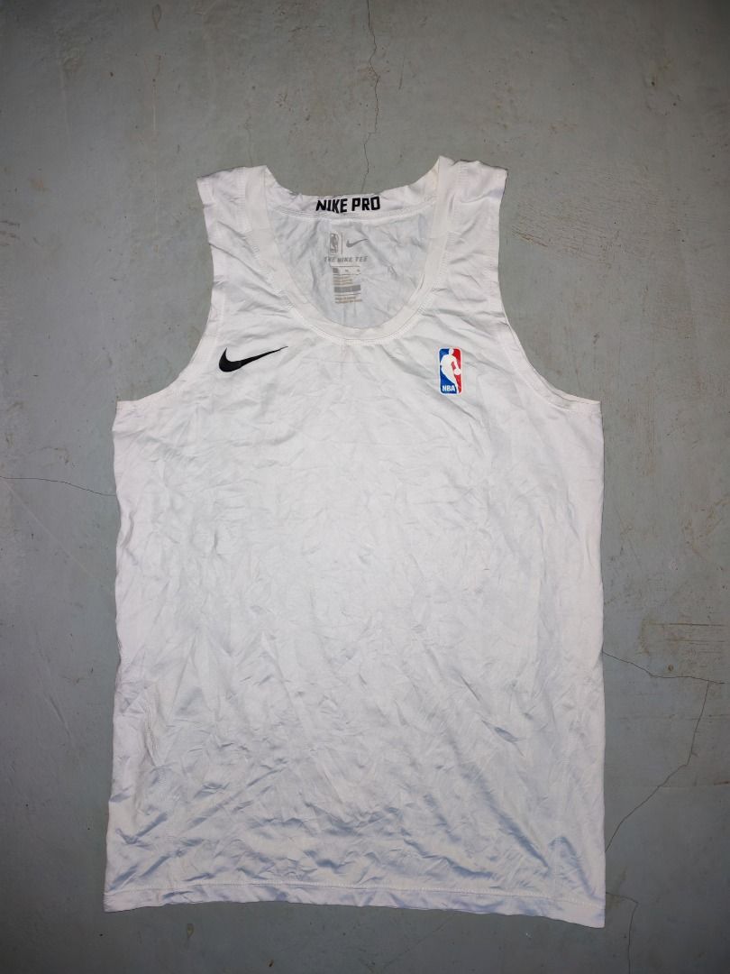 Nike Pro NBA White Tank Top (Category: Activewear) located in Caloocan City. Submitted by silverbird_6c038f (Listing ID 1468803913, Image 1). Description: - Authentic Nike Pro basketball tank top in clean white - Features official NBA logo and classic Nike swoosh on the chest - Nike Pro branding printed on the inner neck collar - Lightweight and sleeveless design for maximum mobility - Perfect for intense workouts, basketball games, or casual str