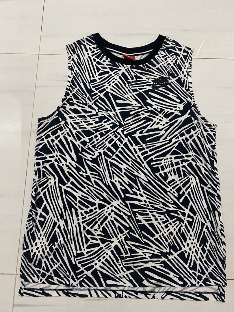 Nike Side swoosh Aop Muscle T (Category: Activewear) located in Manila. Submitted by morsgotthrift (Listing ID 1468765299, Image 2). Description: Nike Side Swosh Aop Muscle T Authentic Size M on tag Width - 21 Length - 28 No issue minimal signs Excellent Condition 480+sf.