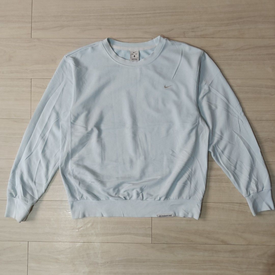Nike Standard Issue Dri-FIT Light Blue Sweatshirt Size L (Category: Coats, Jackets and Outerwear) located in Manila. Submitted by ghello99 (Listing ID 1468847707, Image 1). Description: - Brand: Nike Standard Issue - Color: Light Blue - Size: L (label on collar) - Material/Tech: Dri-FIT moisture management, soft textured fabric inside and out - Details: Small embroidered Nike swoosh on left chest, woven Standard Issue tag near bottom hem - Fit: C