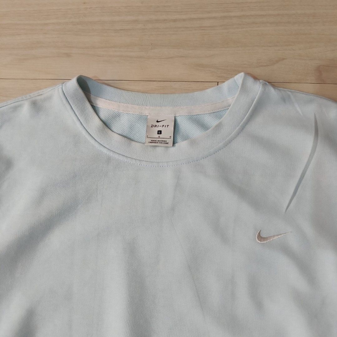 Nike Standard Issue Dri-FIT Light Blue Sweatshirt Size L (Category: Coats, Jackets and Outerwear) located in Manila. Submitted by ghello99 (Listing ID 1468847707, Image 2). Description: - Brand: Nike Standard Issue - Color: Light Blue - Size: L (label on collar) - Material/Tech: Dri-FIT moisture management, soft textured fabric inside and out - Details: Small embroidered Nike swoosh on left chest, woven Standard Issue tag near bottom hem - Fit: C