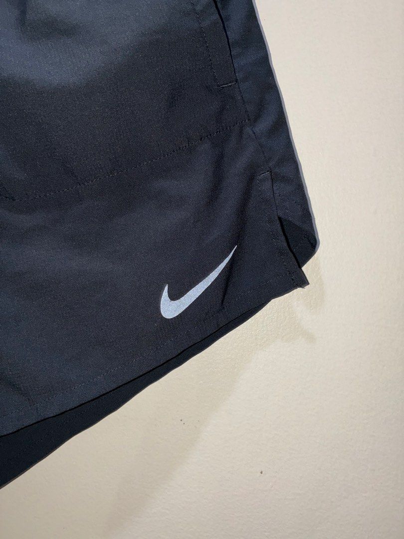 Nike Stride 2-in-1 Running Shorts with Inner Lining (Category: Activewear) located in Pasig City. Submitted by alvinthedecluttererist (Listing ID 1468846475, Image 3). Description: - Authentic black Nike running shorts - Built-in inner liner for added comfort - Elastic waistband with Nike Running branding and adjustable drawstring - Secure zipped pocket at the back for keys or cards - Reflective elements for safe night running - Lightweight fabri