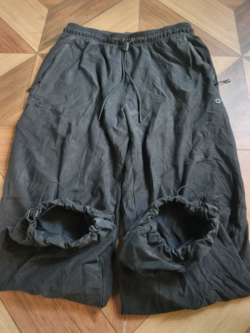 Nike Tech Fleece Black Track Pants (Category: Joggers) located in Zamboanga. Submitted by d2977250664046 (Listing ID 1468880354, Image 3). Description: - Brand: Nike Tech Fleece - Color: Black - Size: Large (32-34x38.5) - Condition: Great casual streetwear piece - Features: Elastic waistband with drawstring, secure zippered side pockets, and adjustable bungee drawcord cuffs - Origin: Made in China - Excellent (NeedWash).