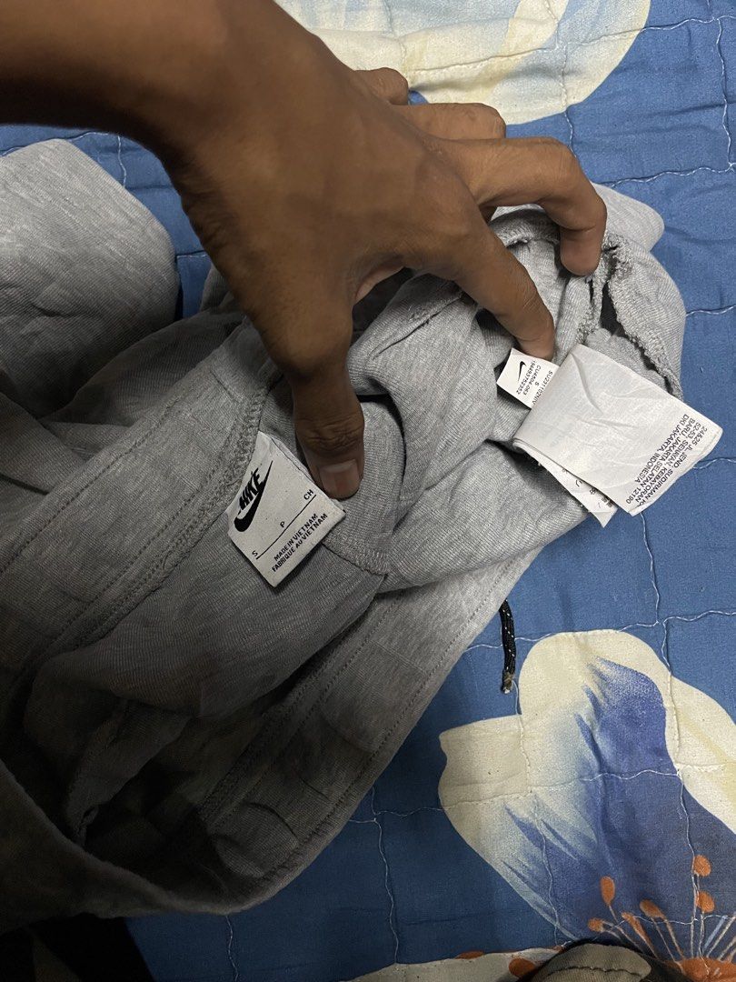 Nike Tech Fleece Grey Shorts Size S (Category: Shorts) located in Manila. Submitted by chawmichael (Listing ID 1468880010, Image 3). Description: - Brand: Nike - Style: Tech Fleece Shorts - Color: Grey - Size: Small - Origin: Made in Vietnam - Condition: Great overall condition - Features: Adjustable drawstring waistband, secure side zipper pocket, and iconic Nike leg logo - Ideal for: Daily casual wear or workouts.