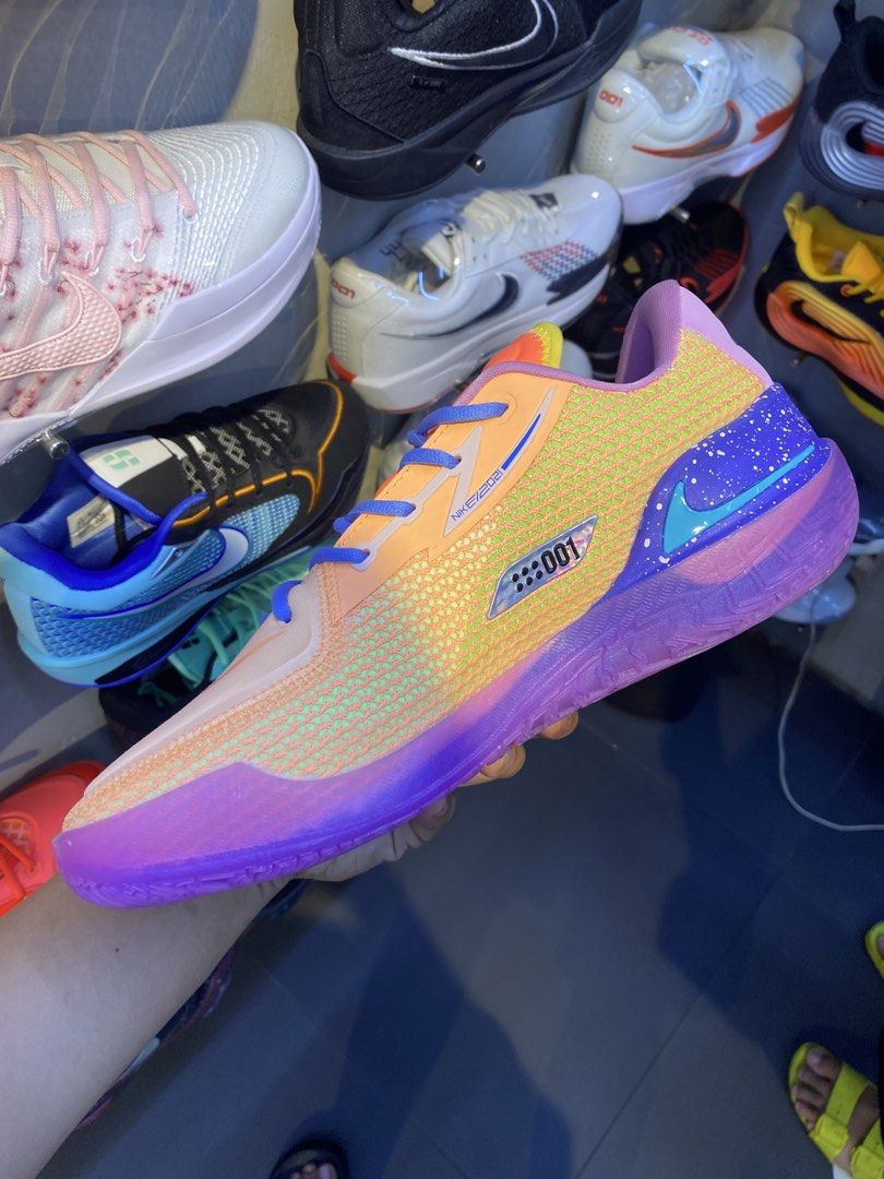 Nike UA gt cut 1 dylan harper (Category: Sneakers) located in Makati City. Submitted by rap_thrift23 (Listing ID 1468862426, Image 3). Description: - Eye-catching multi-color gradient design for the court - Breathable orange mesh upper with blue laces - Bright purple and blue speckled midsole - Silver swoosh details with '001' side branding and 'BEYOND' heel tab - Perfect mix of style and performance for your next game.