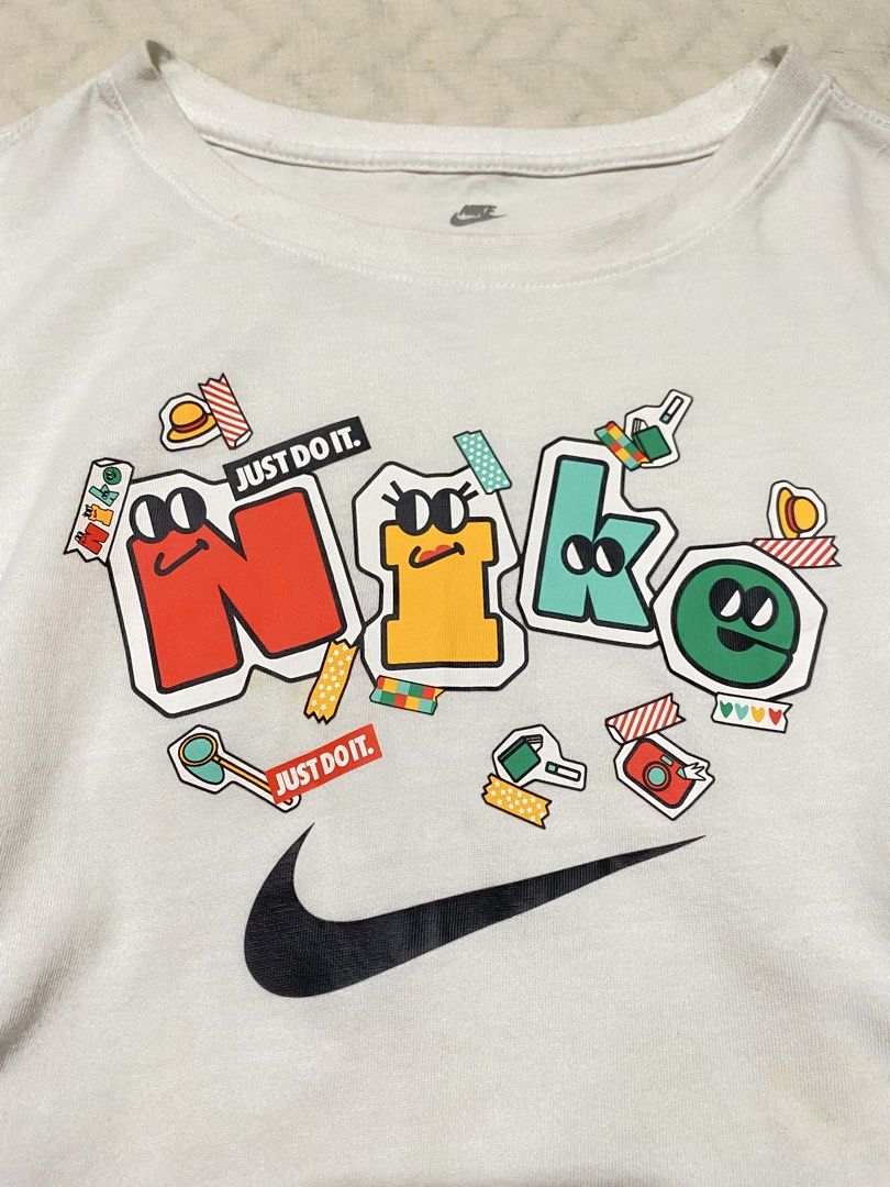 Nike White Graphic Baby Tee (Category: Shirts) located in Marilao. Submitted by kyssmarila (Listing ID 1468884445, Image 3). Description: — Size: S on tag — Dimes: 15x18 — Flaws: yellow stain (not noticeable and can wash) .