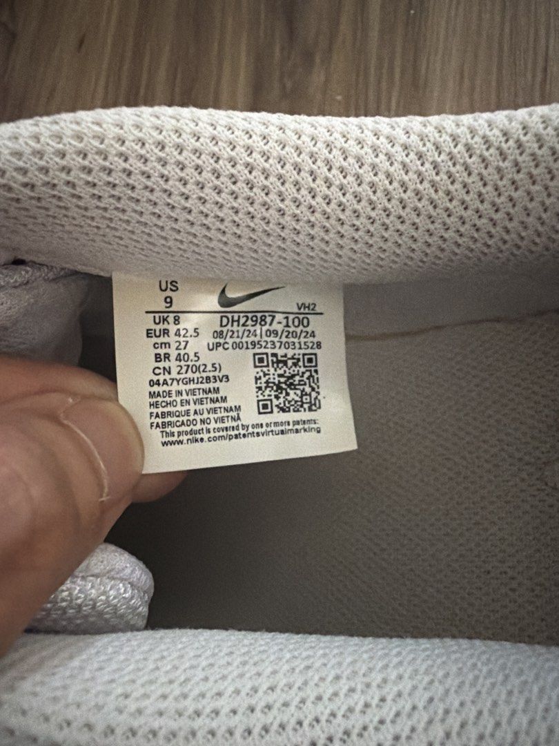 Nike White Low Top Sneakers (Category: Sneakers) located in Bacoor. Submitted by quentinz (Listing ID 1468781041, Image 3). Description: - Style: Classic white low-top sneakers with iconic swoosh branding - Features: Perforated toe boxes and comfortable textured collar padding - Condition: Soles have minor yellowing from age and regular wear - Versatility: Great everyday casual kicks that go with almost anything.