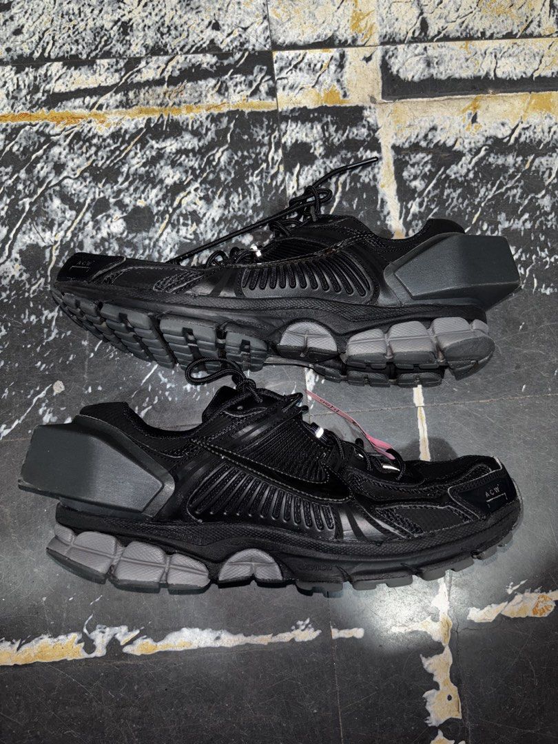 Nike x A-Cold-Wall Vomero 5 Black (Category: Sneakers) located in Caloocan City. Submitted by neweagle-424b (Listing ID 1468830917, Image 1). Description: - Model: Nike x A-Cold-Wall Collaboration Sneakers - Colorway: Triple Black with reflective details - Design: Distinct architectural heel piece with ACW toe and heel branding - Comfort & Durability: Cushioned midsole with a rugged rubber outsole - Aesthetic: Perfect for the techwear look - Cond