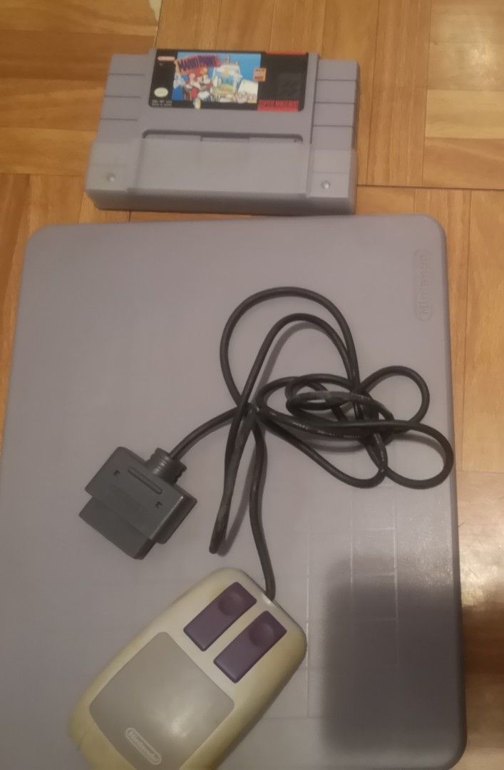 Nintendo Super NES SNES Mario Paint Mouse and Pad (Category: Nintendo) located in Quezon City. Submitted by dhanie.barican (Listing ID 1468846596, Image 2). Description: - Authentic Super Nintendo Mario Paint bundle for retro gaming fans - Includes original SNES game cartridge and official SNES mouse - Comes with plastic mouse pad, instruction booklet, and promotional paper insert - Note: Mouse plastic has some natural yellowing from age - Comple