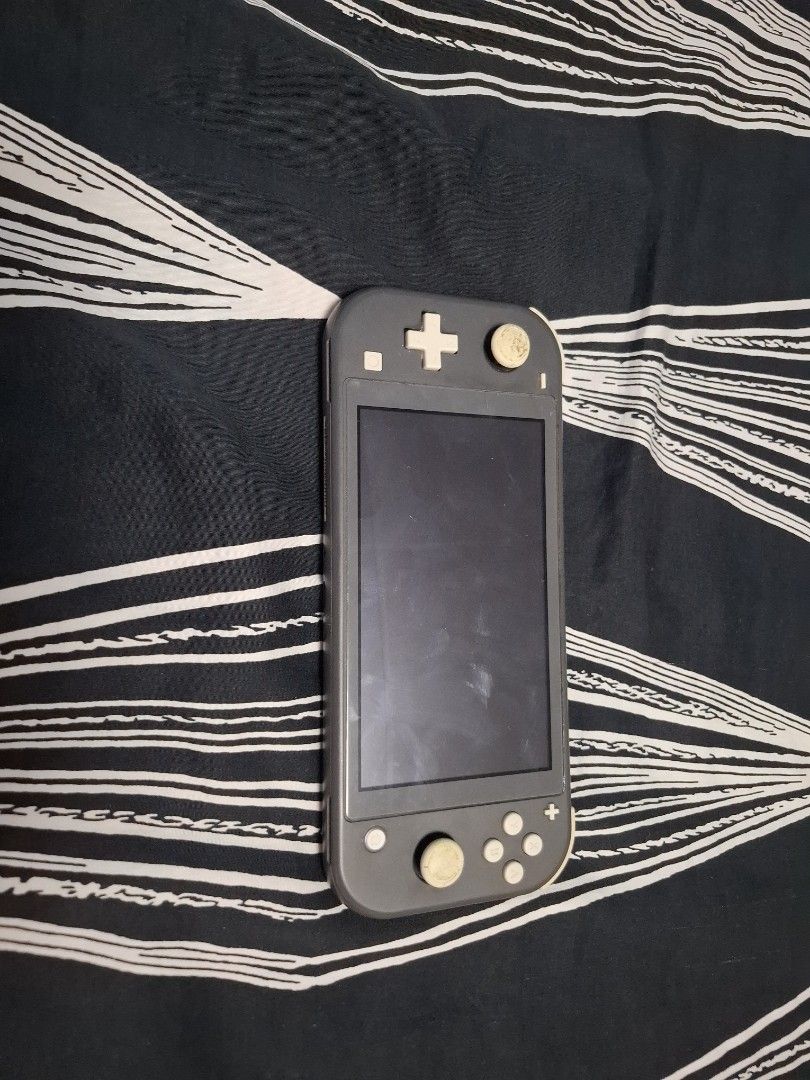 Nintendo Switch Lite Gray with free case (Category: Nintendo) located in Iloilo. Submitted by crizzeazy (Listing ID 1468750332, Image 1). Description: - Color: Gray - Condition: Fully functional with regular signs of use and slight thumbstick discoloration - Features: Portable handheld system with integrated controls - Perfect for: Travel and playing Switch games on the go - free case included.