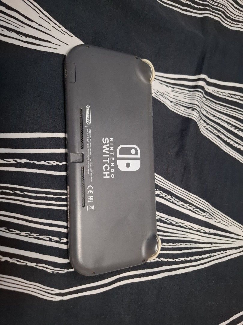 Nintendo Switch Lite Gray with free case (Category: Nintendo) located in Iloilo. Submitted by crizzeazy (Listing ID 1468750332, Image 2). Description: - Color: Gray - Condition: Fully functional with regular signs of use and slight thumbstick discoloration - Features: Portable handheld system with integrated controls - Perfect for: Travel and playing Switch games on the go - free case included.