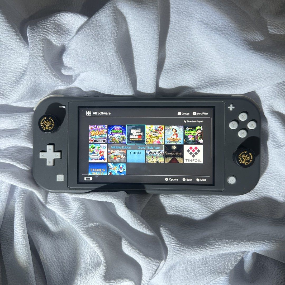 NINTENDO SWITCH LITE JAILBREAK - GRAY (Category: Other Gadgets) located in Caloocan City. Submitted by eightyythrift (Listing ID 1468843199, Image 1). Description: Nintendo Switch Lite Gray Jailbreak Unit • With SanDisk 128G B SD Card • Comes with multiple games • Jailbreak unit. Can’t connect to wifi. Good for offline games • Unit only (Still have the OG charger but it’s in Marikina. Can provide details for Lalamove if buyer wants to include the