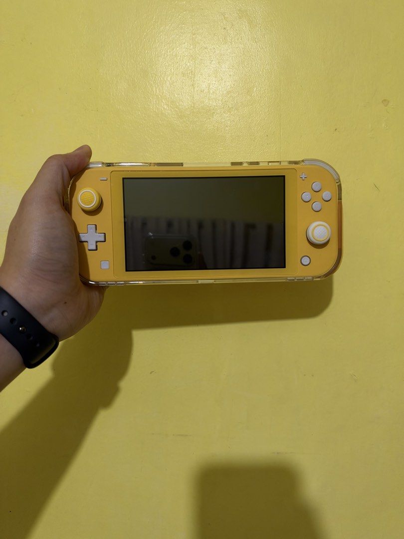 Nintendo Switch Lite Yellow (Category: Nintendo) located in Quezon City. Submitted by aimahoe (Listing ID 1468723156, Image 2). Description: Condition: Like new (only used for a week) - No scratches - No Defects/Issues Inclusions: - Clear case adjustable handles - Protective Carrying Case - Tempered Glass (installed day 1) - Box, charger, and manuals Meet up only!.