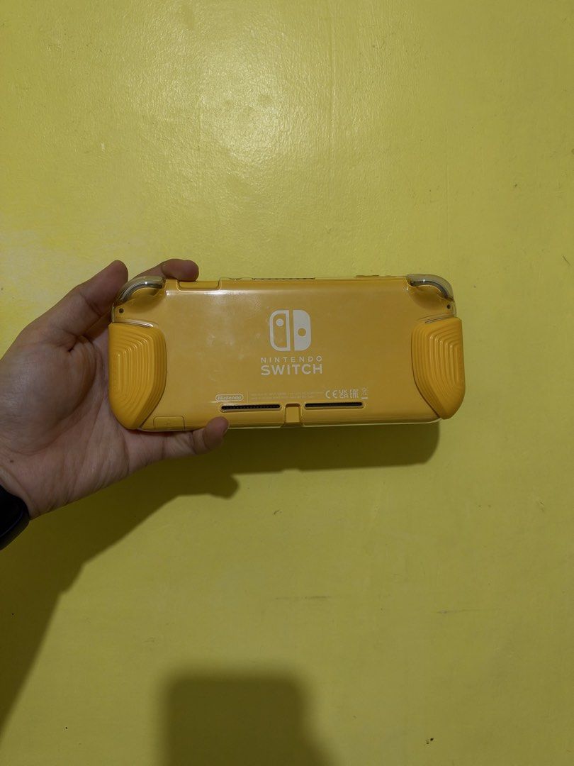 Nintendo Switch Lite Yellow (Category: Nintendo) located in Quezon City. Submitted by aimahoe (Listing ID 1468723156, Image 3). Description: Condition: Like new (only used for a week) - No scratches - No Defects/Issues Inclusions: - Clear case adjustable handles - Protective Carrying Case - Tempered Glass (installed day 1) - Box, charger, and manuals Meet up only!.