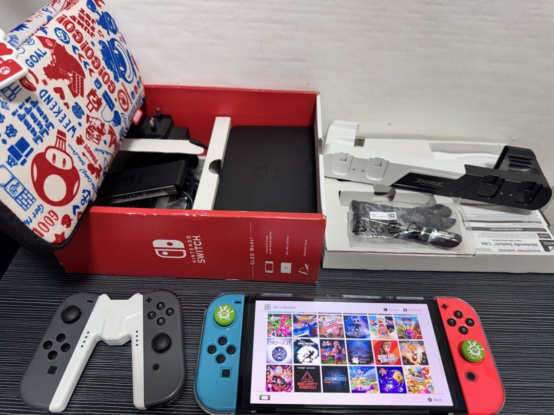 Nintendo Switch OLED (Category: Nintendo) located in Navotas City. Submitted by animatorside (Listing ID 1468754954, Image 3). Description: SECOND HAND NINTENDO SWITCH OLED JB 512 GB. 16,000 LAST PRICE. No hidden issues. Full of games ready to play na po gagamitin nalang. Paki check nalang po sa pictures yung mga games. Complete accessories DOCK, HDMI CABLE, GRIP, STRAPS, BOX. With free Dobe charging dock, free 1 extra original Joy-Con, free 1 ex