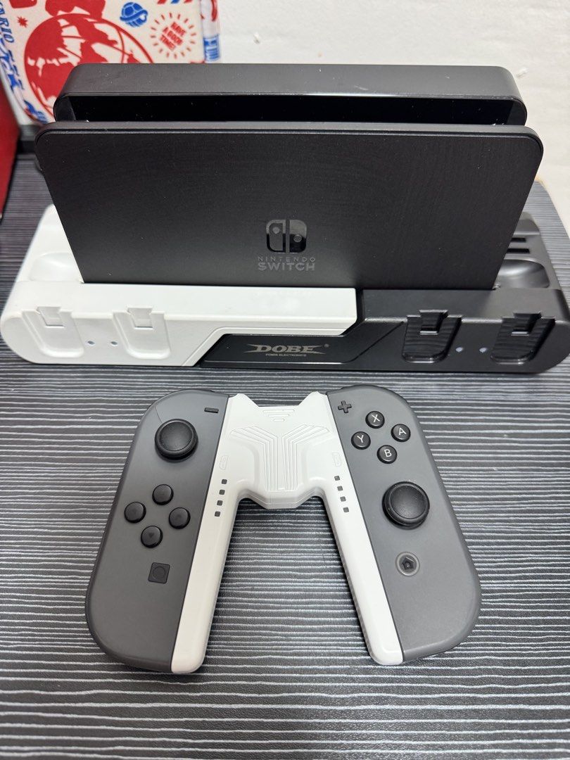 Nintendo Switch OLED (Category: Nintendo) located in Navotas City. Submitted by animatorside (Listing ID 1468754954, Image 2). Description: SECOND HAND NINTENDO SWITCH OLED JB 512 GB. 16,000 LAST PRICE. No hidden issues. Full of games ready to play na po gagamitin nalang. Paki check nalang po sa pictures yung mga games. Complete accessories DOCK, HDMI CABLE, GRIP, STRAPS, BOX. With free Dobe charging dock, free 1 extra original Joy-Con, free 1 ex