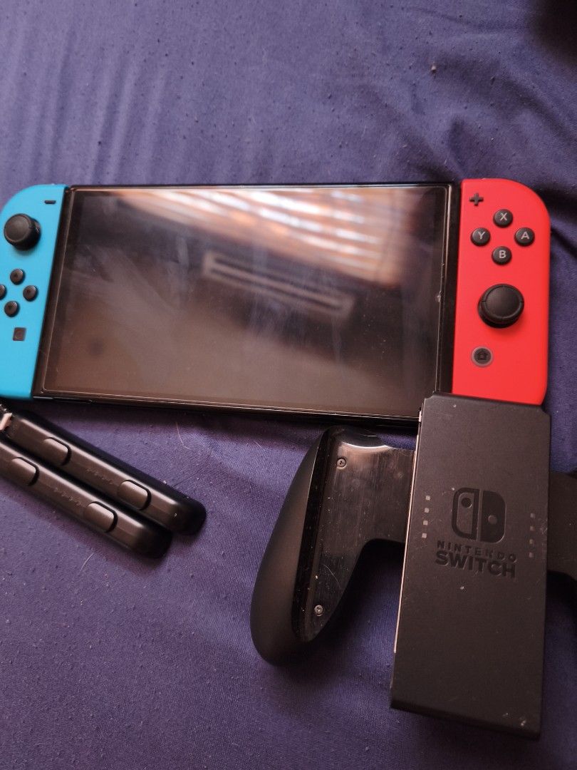 Nintendo Switch OLED (Category: Nintendo) located in Pasay City. Submitted by cnm.0728 (Listing ID 1468809751, Image 3). Description: Nintendo Switch OLED with Pokémon ZA and Arceus, Overcooked All You Can Eat, Mario Cart 8 Deluxe and Nintendo Sports.