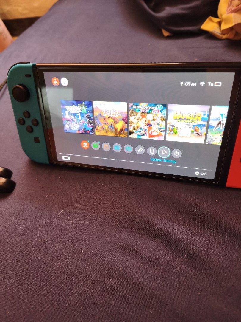 Nintendo Switch OLED (Category: Nintendo) located in Pasay City. Submitted by cnm.0728 (Listing ID 1468809751, Image 2). Description: Nintendo Switch OLED with Pokémon ZA and Arceus, Overcooked All You Can Eat, Mario Cart 8 Deluxe and Nintendo Sports.