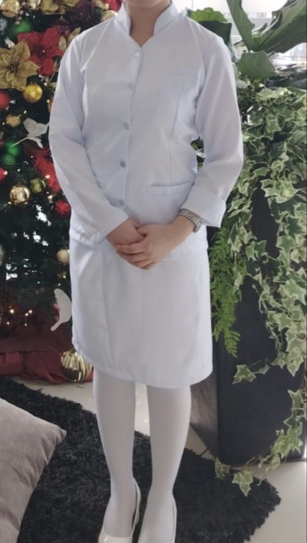 Nursing Gala Uniform (Category: Sets or Coordinates) located in Caloocan City. Submitted by kmiracle2733395 (Listing ID 1468827528, Image 2). Description: White nurse uniform set, includes long sleeve button-up top with stand collar and matching skirt. Size XS. Top has shoulder width 14.5 inches, bust 34 inches, chest 17 inches, length 21 inches. Skirt waist 26 to 28 inches, length 22 inches..