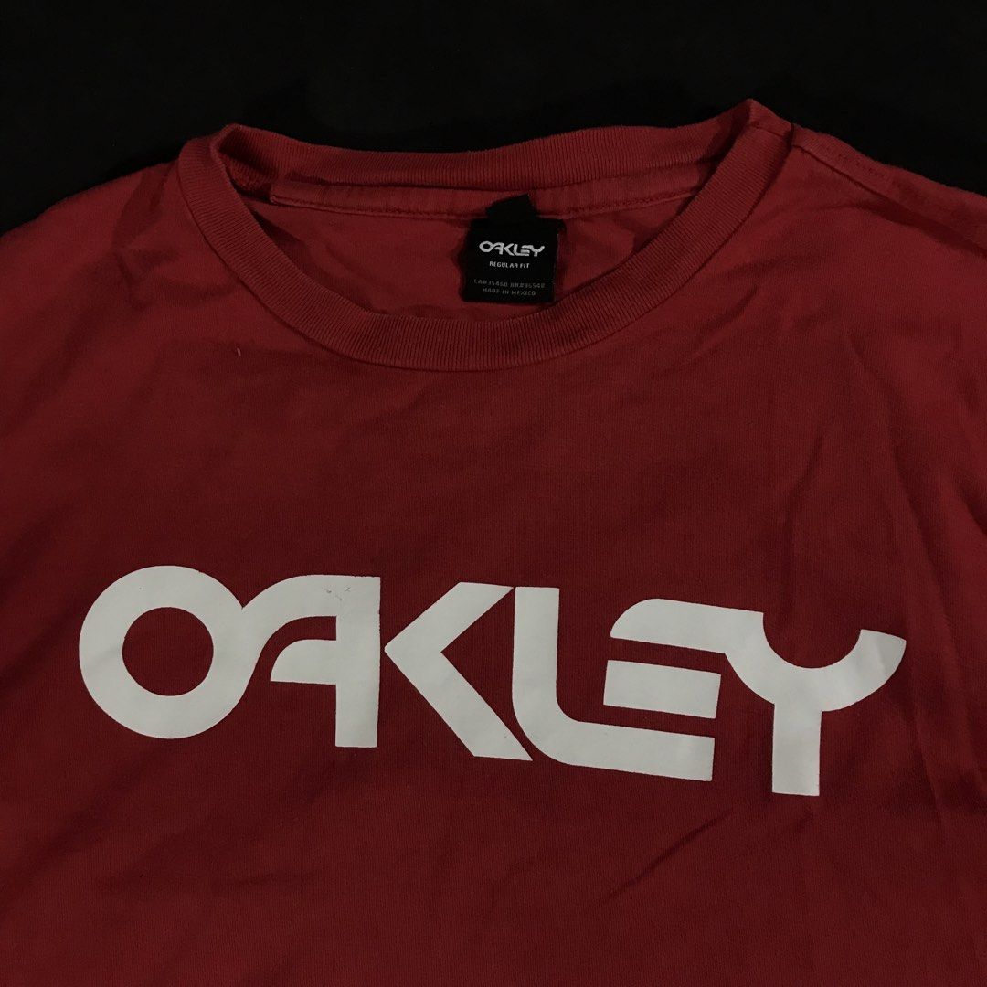 Oakley Logo Short-Sleeve Compression T-Shirt (Category: Tshirts & Polo Shirts ) located in Manila. Submitted by a_aron.f6e3a7 (Listing ID 1468785536, Image 3). Description: Size: Small • Color rate: 9/10 (Red with White Oakley Logo) • Condition: Good pre-owned condition • Issues: Visible wrinkles and creases; no obvious major holes or tears .