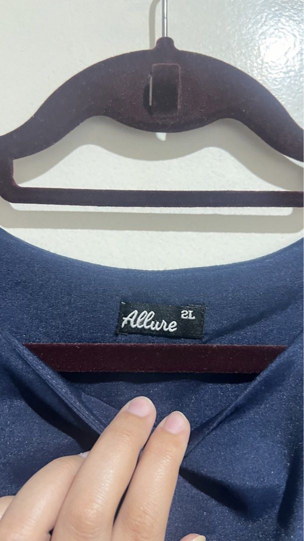 Office Blouse (Category: Blouses) located in Cabuyao City. Submitted by calmstorm.0108 (Listing ID 1468835039, Image 2). Description: - Brand: Allure - Size: 2L - Color: Navy Blue - Fit: Relaxed and comfortable - Features: Short sleeves, wide neckline, pleated front panel, and double-layer hem - Condition: Clean and well-maintained, inside and out - Styling: Perfect for daily wear, easily paired with jeans or slacks.