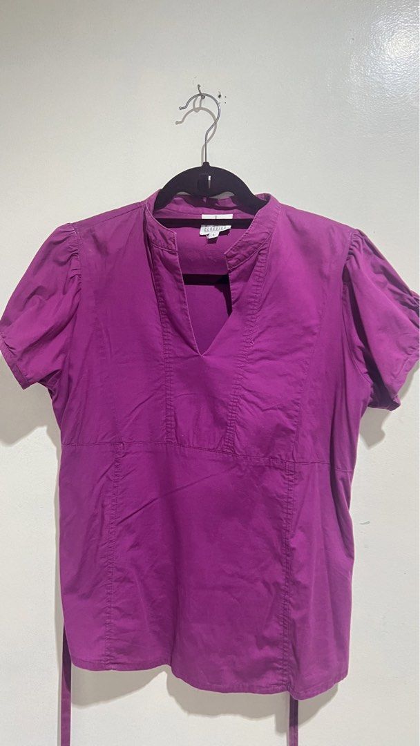 Office Blouse Short Sleeve Blouse (Category: Blouses) located in Cabuyao City. Submitted by calmstorm.0108 (Listing ID 1468835730, Image 1). Description: - Brand: CC Classics - Size: Large - Color: Vibrant Purple - Style: Short sleeve blouse with V-neckline and collar detail - Sleeves: Trendy puff sleeves - Fit: Adjustable with back tie straps - Condition: Great everyday top, comfortable to wear.