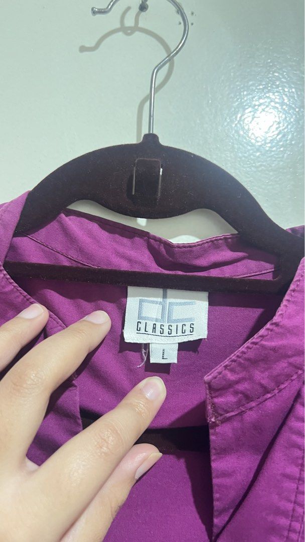 Office Blouse Short Sleeve Blouse (Category: Blouses) located in Cabuyao City. Submitted by calmstorm.0108 (Listing ID 1468835730, Image 2). Description: - Brand: CC Classics - Size: Large - Color: Vibrant Purple - Style: Short sleeve blouse with V-neckline and collar detail - Sleeves: Trendy puff sleeves - Fit: Adjustable with back tie straps - Condition: Great everyday top, comfortable to wear.