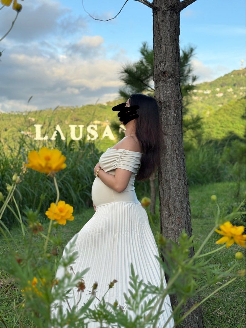 Off-shoulder Pleated Maternity Dress (Category: Dresses) located in San Pedro. Submitted by hey.iza (Listing ID 1468832457, Image 3). Description: - Color: Cream/Apricot - Style: Off-shoulder neckline with a flattering ruched bodice and flowing pleated skirt - Fit: Stretchy fabric up top and lightweight material below - Condition: Excellent, worn only once for a photoshoot and freshly washed. Like new. - Perfect for maternity shoots, baby showers