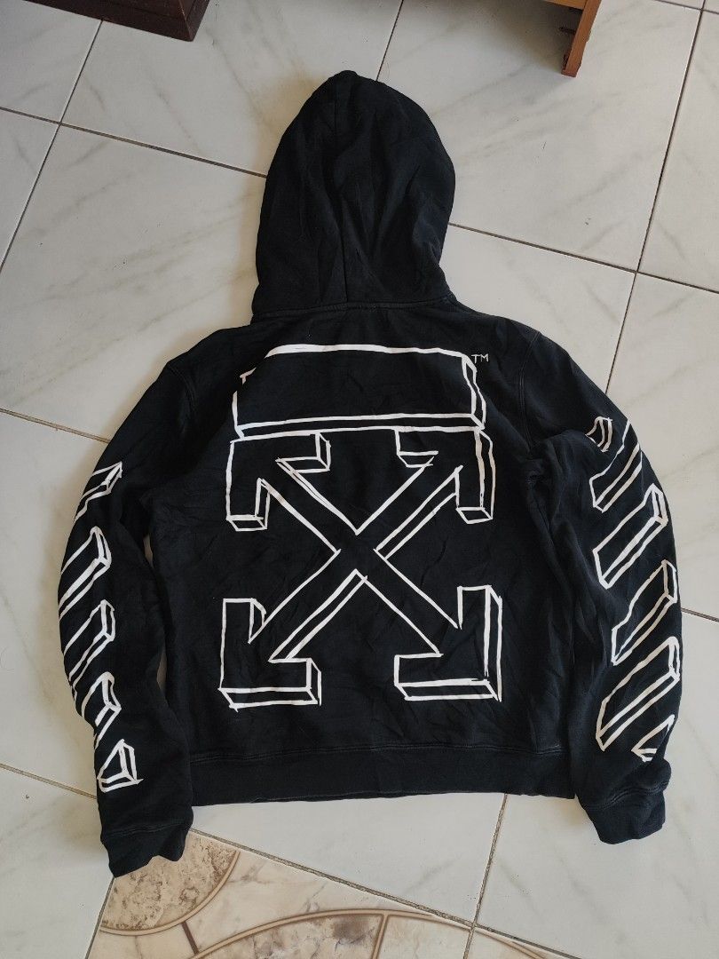 Off-White Black Marker Arrows Hoodie (Category: Coats, Jackets and Outerwear) located in Tuguegarao City. Submitted by johnpetera0818 (Listing ID 1468901730, Image 1). Description: - Authentic Off-White hoodie in classic black - Iconic marker graphics on the back and sleeves -issue minimal hairline cracks - Subtle Off-White logo print on the chest - Practical kangaroo pocket and adjustable drawstring hood - Premium 100% cotton, made in Portugal -