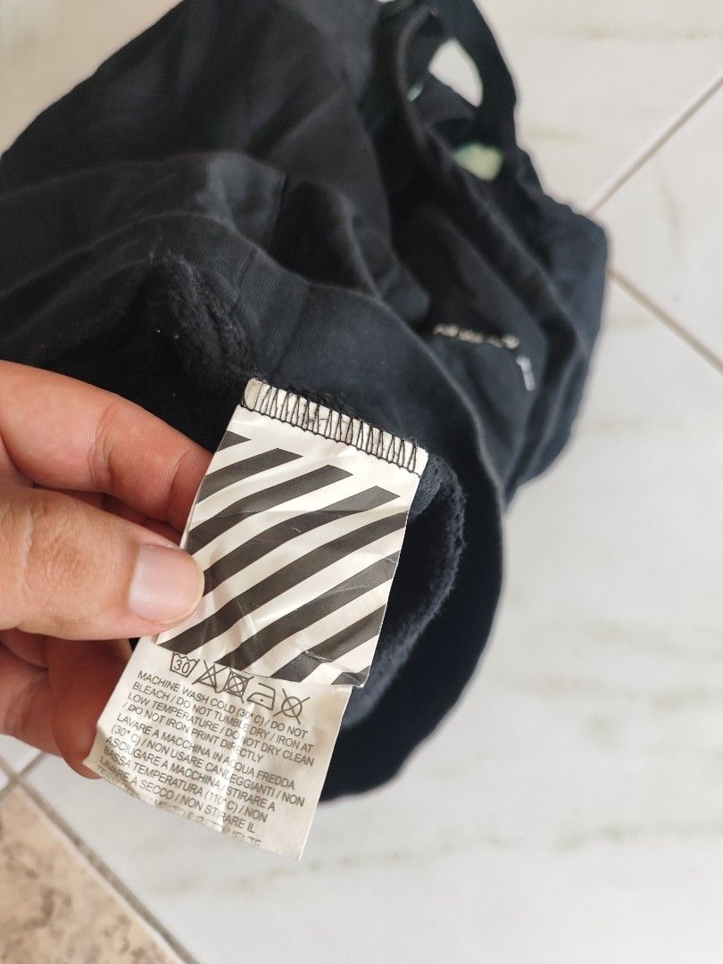 Off-White Black Marker Arrows Hoodie (Category: Coats, Jackets and Outerwear) located in Tuguegarao City. Submitted by johnpetera0818 (Listing ID 1468901730, Image 3). Description: - Authentic Off-White hoodie in classic black - Iconic marker graphics on the back and sleeves -issue minimal hairline cracks - Subtle Off-White logo print on the chest - Practical kangaroo pocket and adjustable drawstring hood - Premium 100% cotton, made in Portugal -